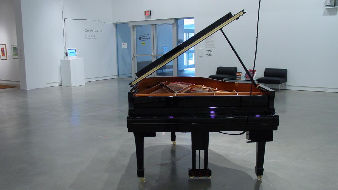 a grand piano in an empty room