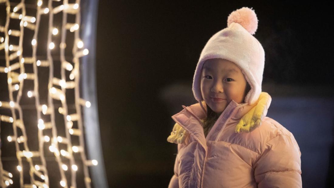 Child in archway at Bear Creek Park Lights