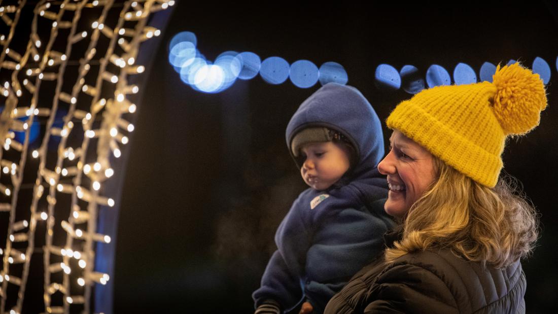 Parent and child looking at lights