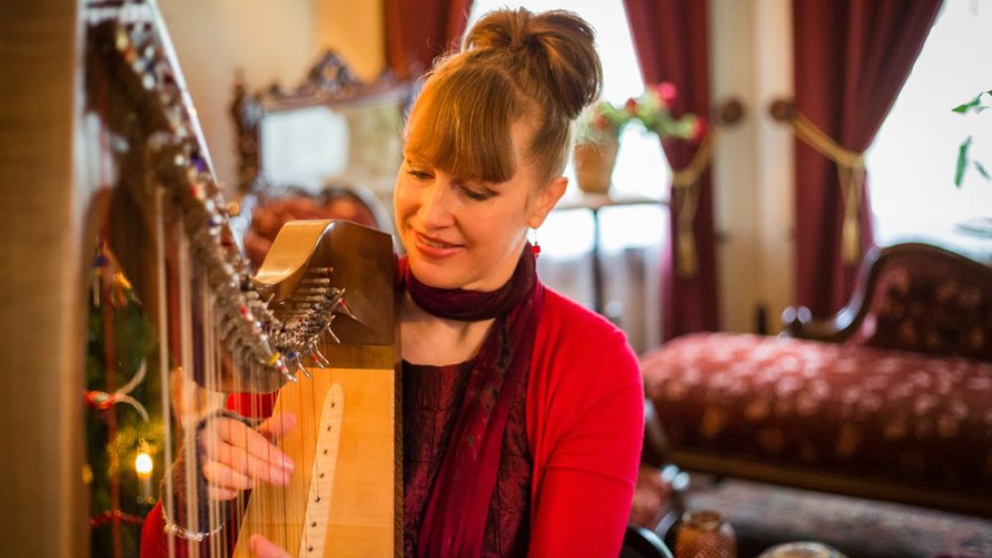 Leanne Page playing the harp