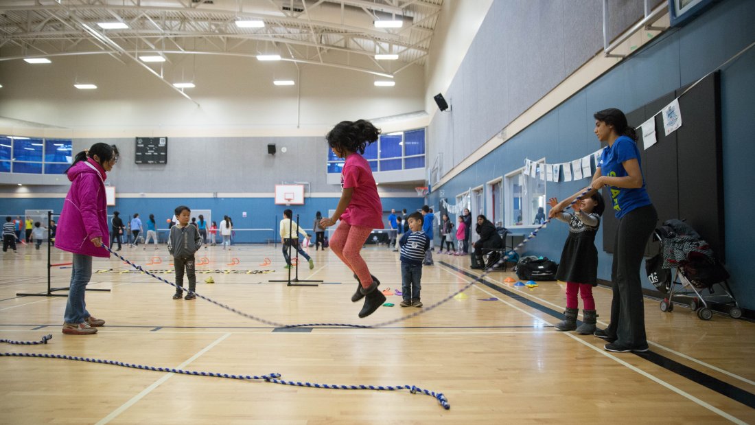 Kids jumping rope.