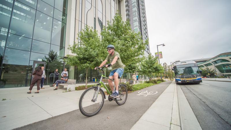 A man cycles on a bike lane