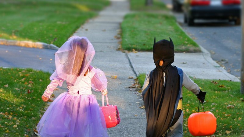 two kids in costumes