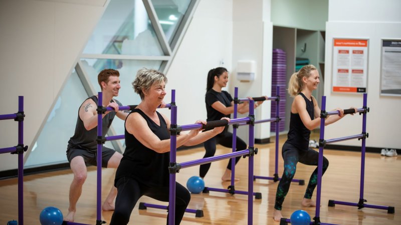 Participants in a barre class.