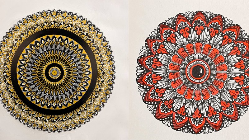 Two mandalas side to side. The left one is a gold and black pattern. The right one is a floral pattern with red and black. 
