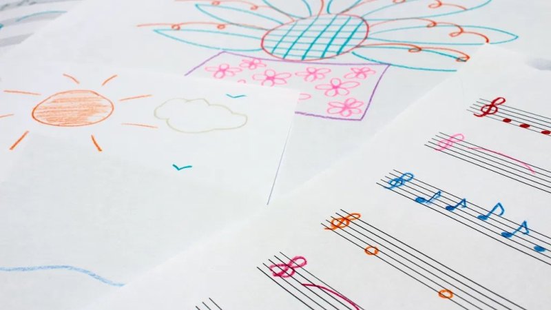 Pencil crayon drawings and sheet music.