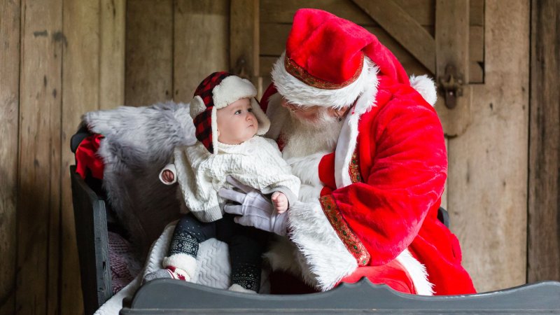 Saint Nick holding a baby