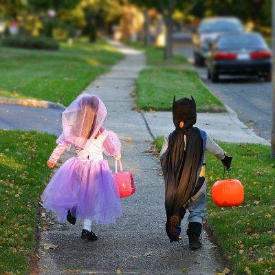 two kids in costumes