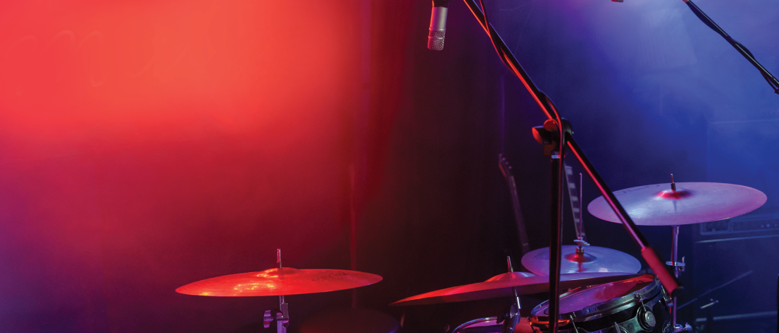 A drum kit in a red and purple background