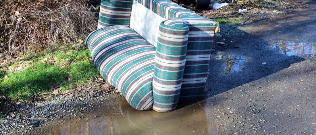 sofa dumped out on street