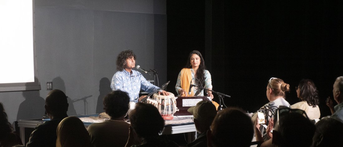 people seating with music instruments