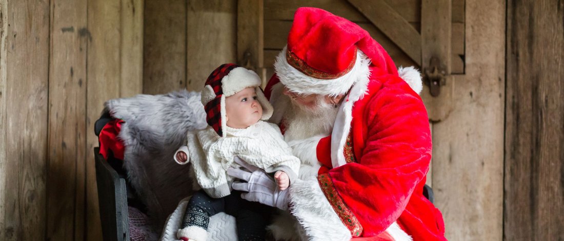 Saint Nick holding a baby