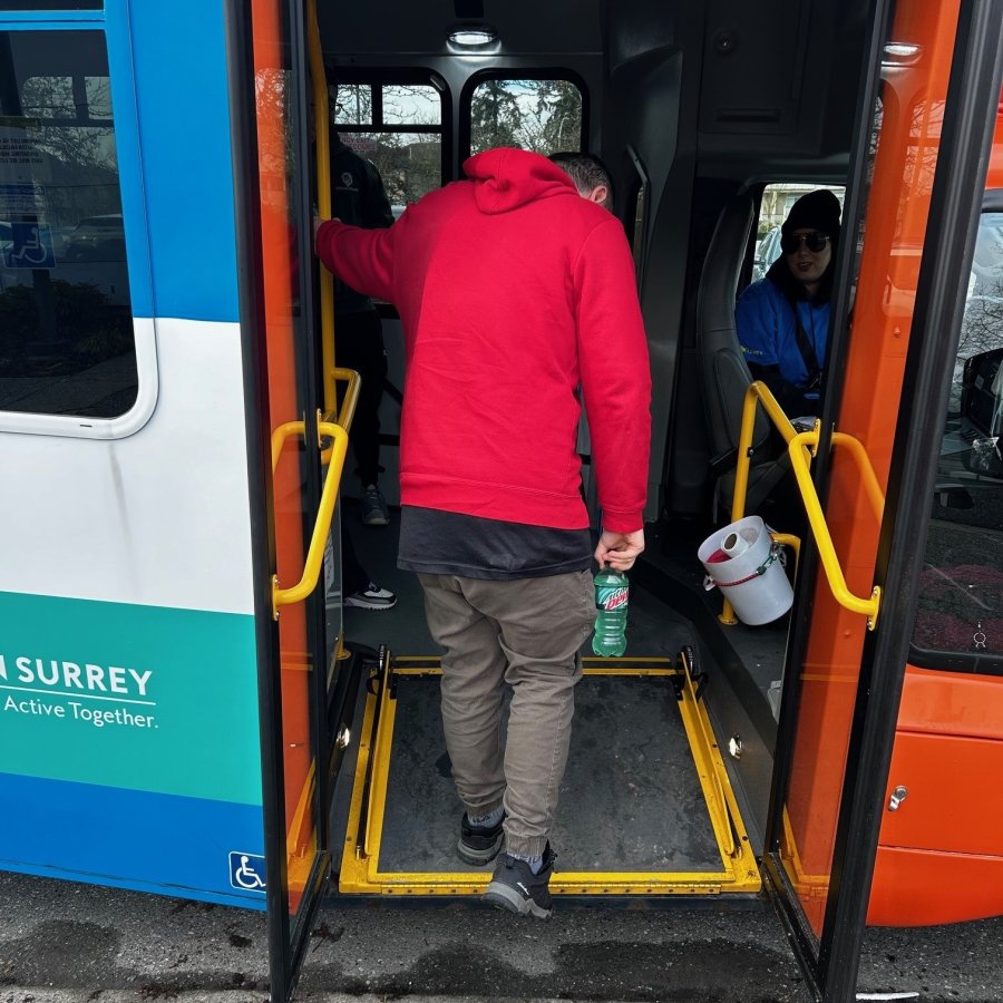 A person getting on a bus.
